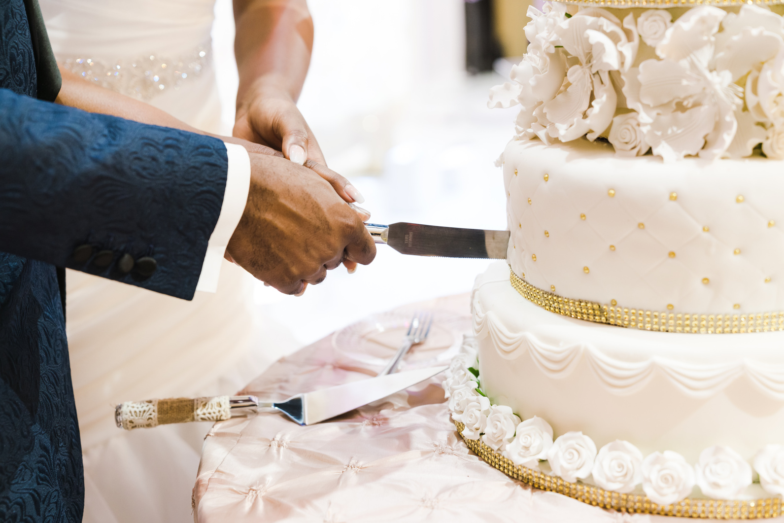 Newlyweds Slicing Wedding Cake